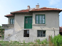 house at the end of a village