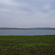 Big plot of agricultural land near lake
