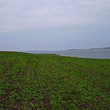 Big plot of agricultural land near lake