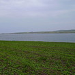 Big plot of agricultural land near lake