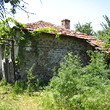 Old rural house with big garden at the end of the village