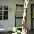 Old rural house with big garden at the end of the village