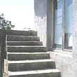 One Storey House And A New Building In Common Yard