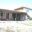 One Storey House And A New Building In Common Yard