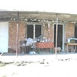 One Storey House And A New Building In Common Yard