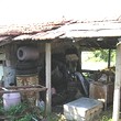 One Storey House And A New Building In Common Yard