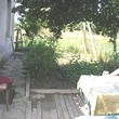 One Storey House And A New Building In Common Yard