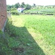 One Storey House And A New Building In Common Yard