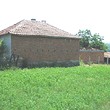 One Storey House And A New Building In Common Yard