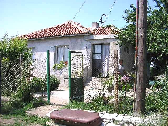 One Storey House And A New Building In Common Yard