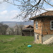 Solid rural house with additional building