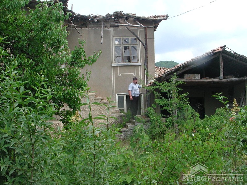 Old House In The Center Of A Village