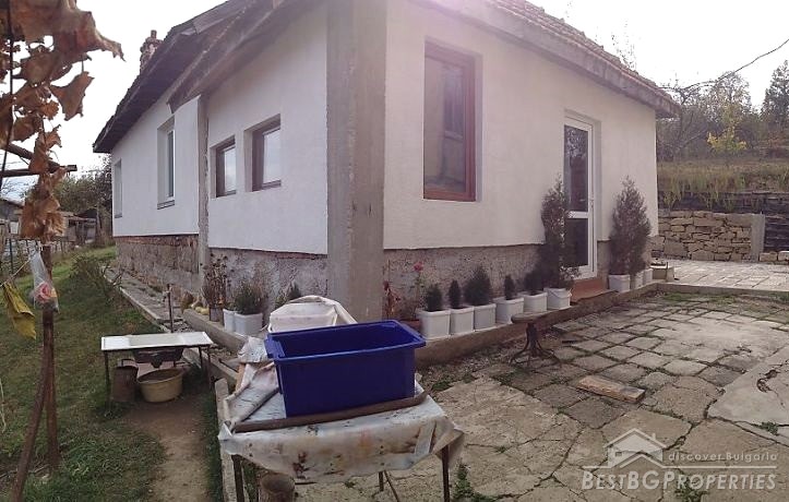 Two houses on a shared plot of land in the mountains