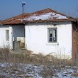 Small house with large land near the sea