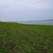 Big plot of agricultural land near lake
