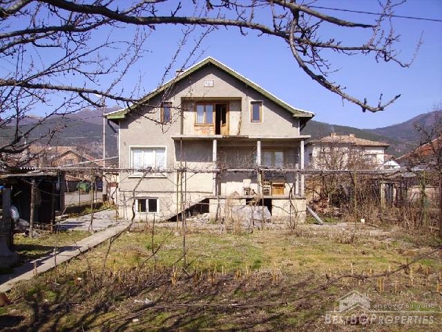 Two storey house at the foot of the mountain