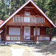 Wooden chalets on a lake close to Borovets