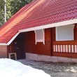 Wooden chalets on a lake close to Borovets